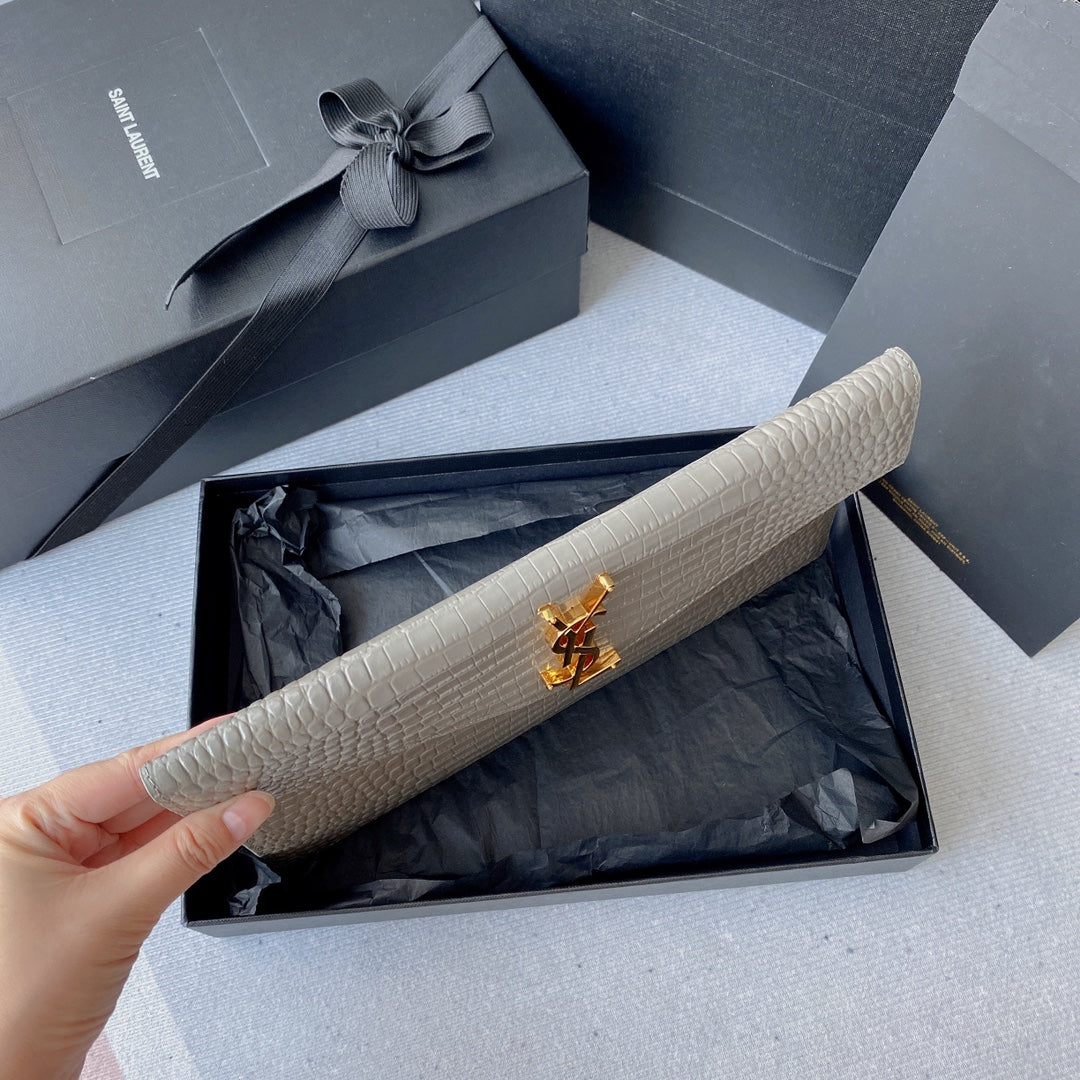 UPTOWN POUCH 27 IN PASTEL GRAY CROCODILE-EMBOSSED SHINY CALFSKIN GOLD LOGO mysite