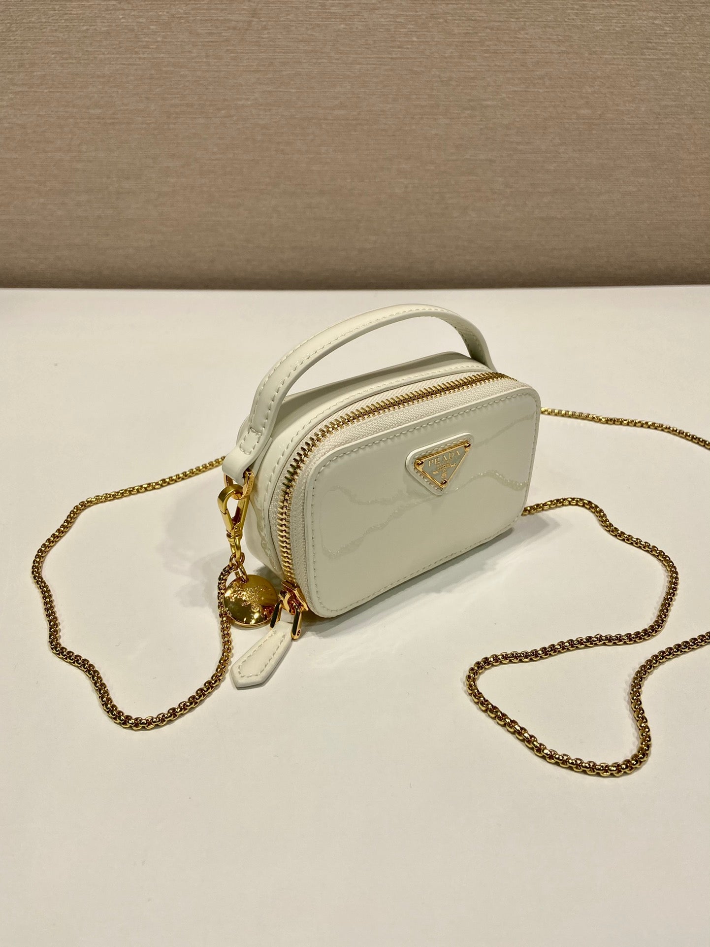 MINI HAND BAG 11 WITH GOLD STRAP IN WHITE PATENT CALFSKIN mysite