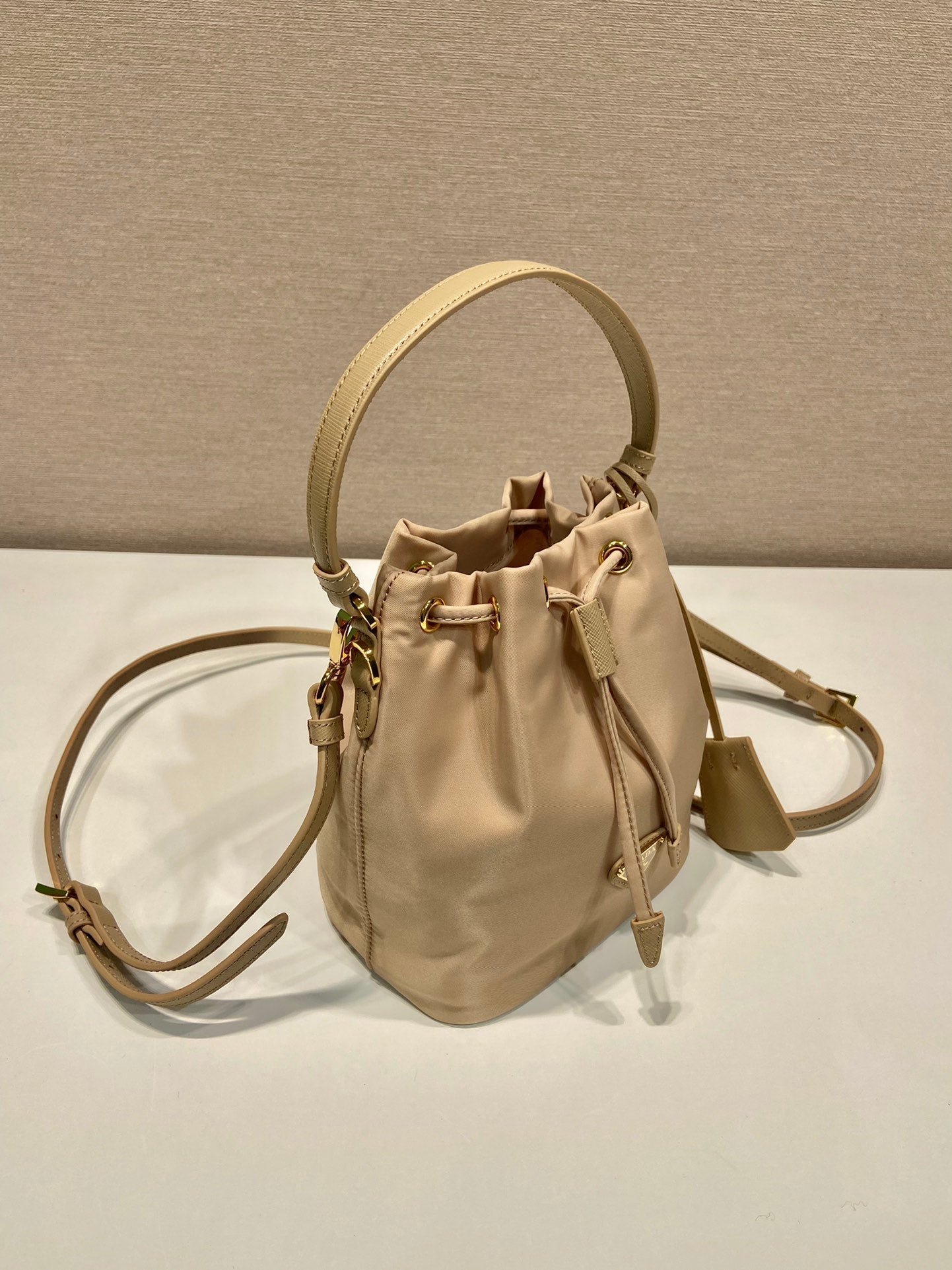 BUCKET BAG 19 IN BEIGE RE-NYLON AND SAFFIANO LEATHER HANDLE mysite