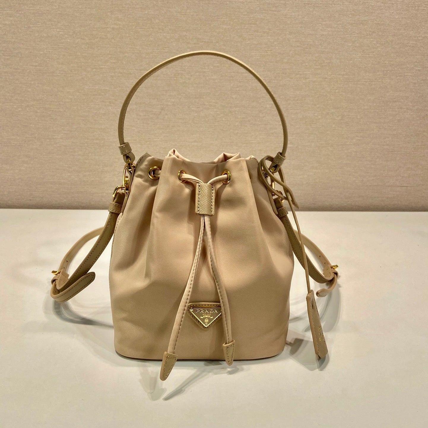 BUCKET BAG 19 IN BEIGE RE-NYLON AND SAFFIANO LEATHER HANDLE mysite