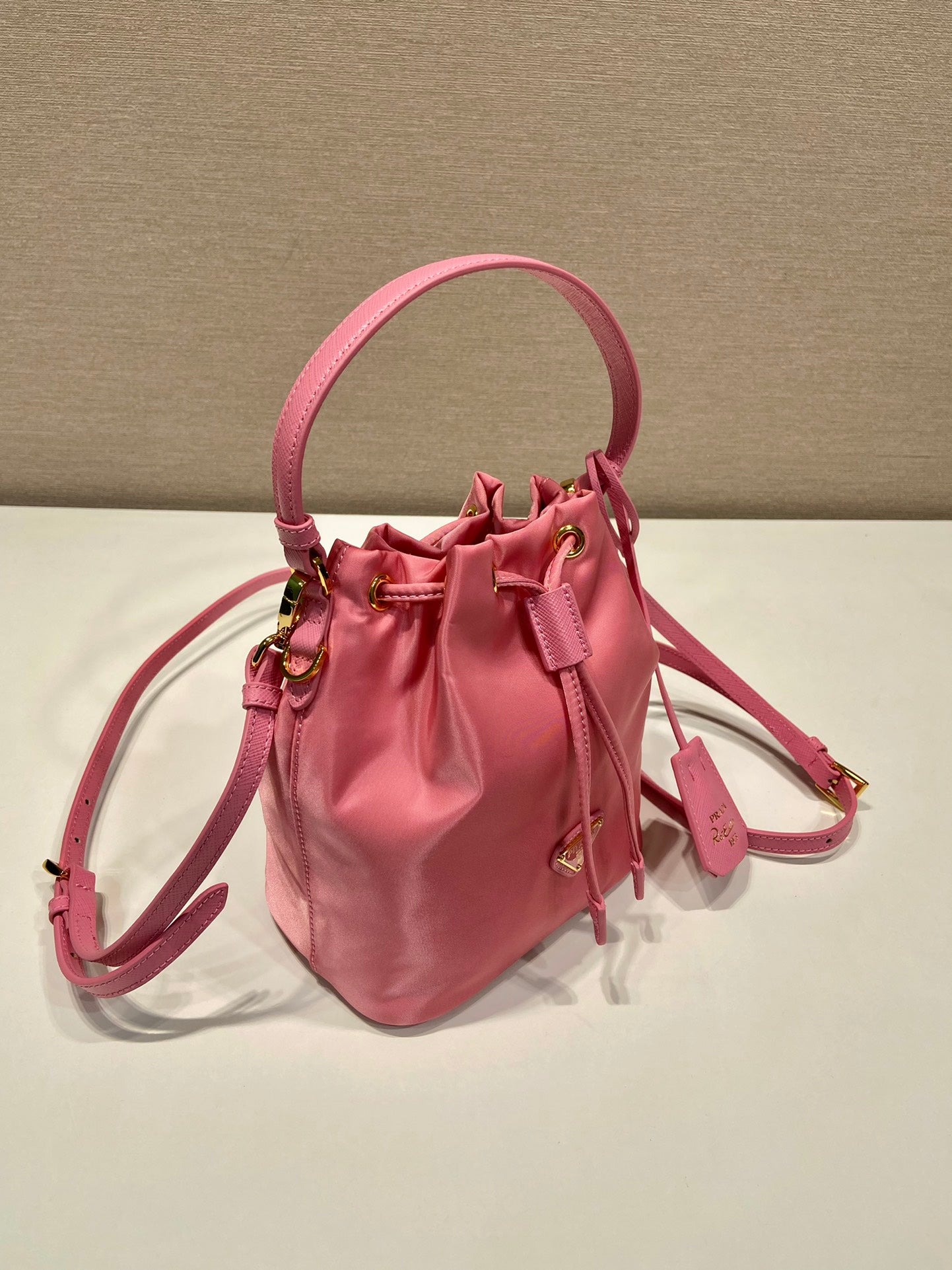 BUCKET BAG 19 IN CANDY PINK RE-NYLON AND SAFFIANO LEATHER HANDLE mysite