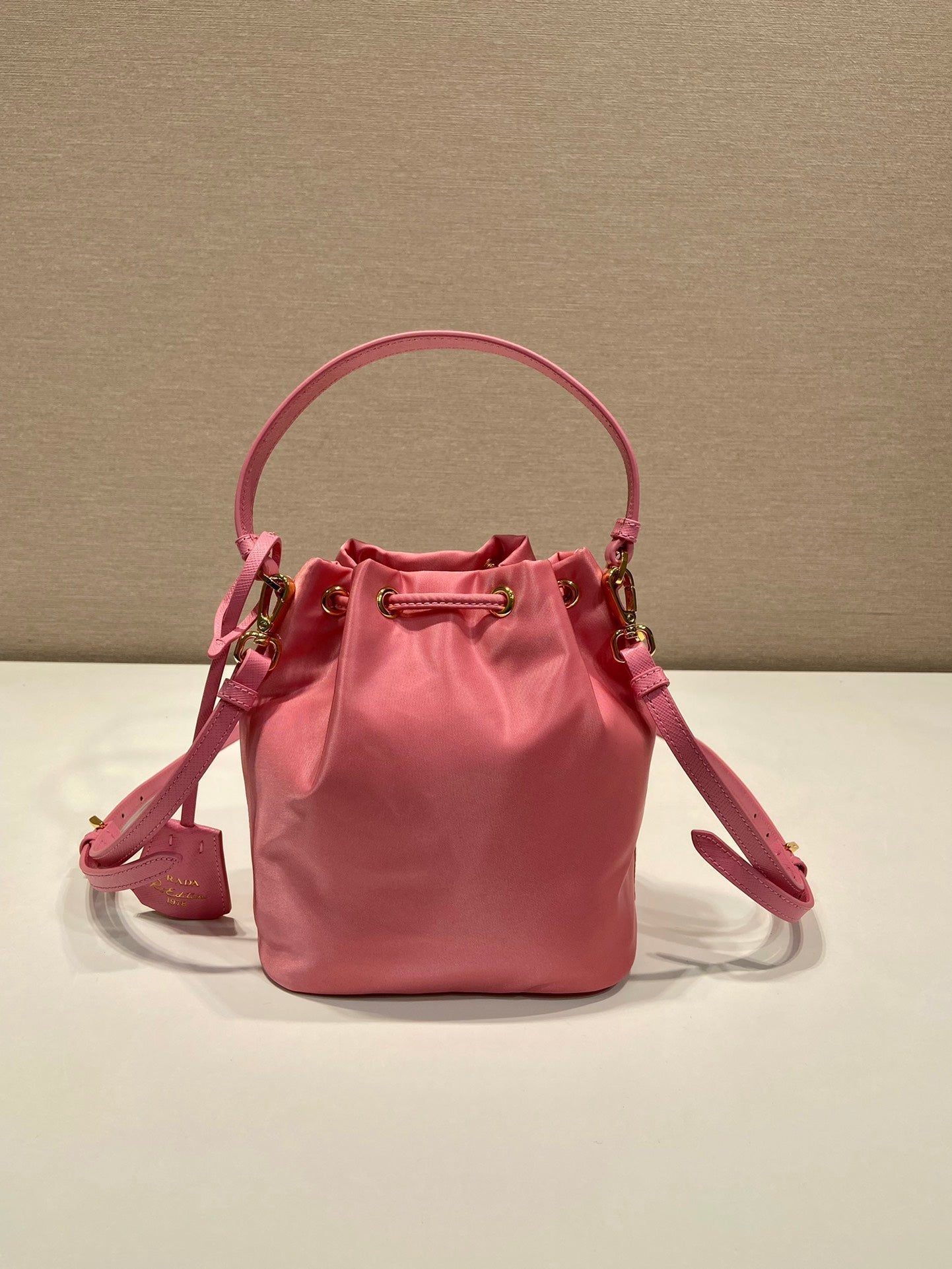 BUCKET BAG 19 IN CANDY PINK RE-NYLON AND SAFFIANO LEATHER HANDLE mysite