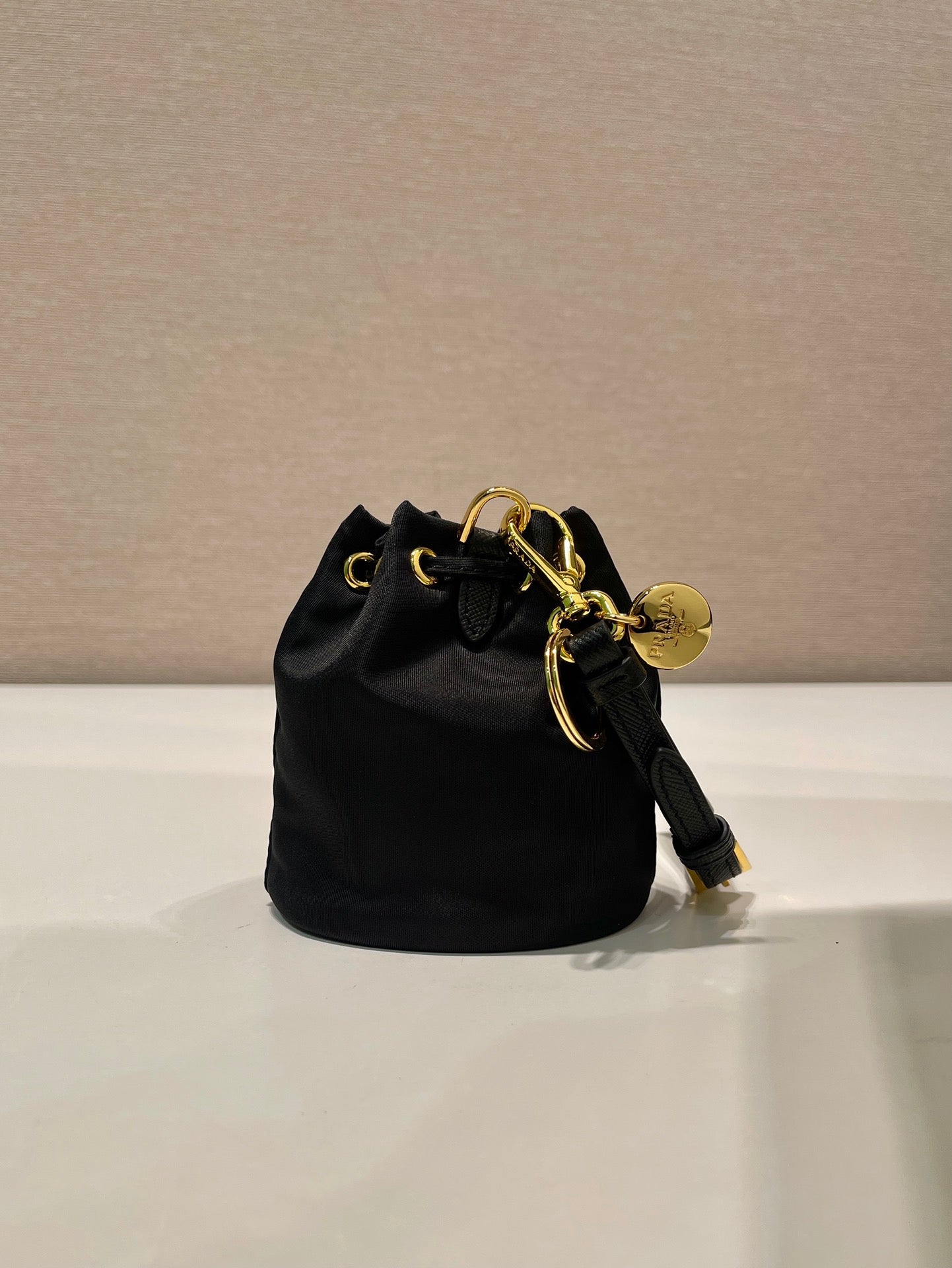 MINI BUCKET BAG 10 IN BLACK RE-NYLON AND SAFFIANO LEATHER STRAP mysite
