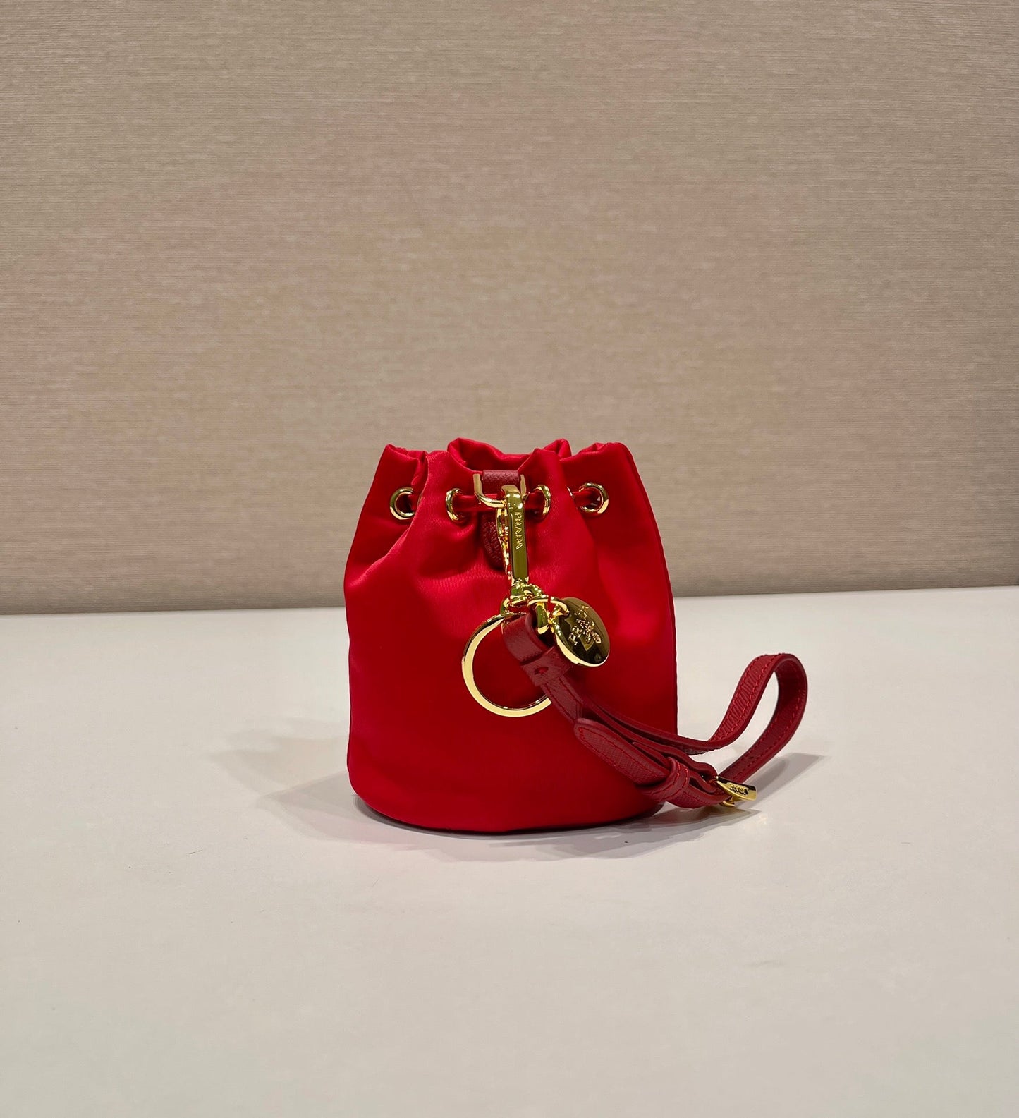 MINI BUCKET BAG 10 IN RED RE-NYLON AND SAFFIANO LEATHER STRAP mysite