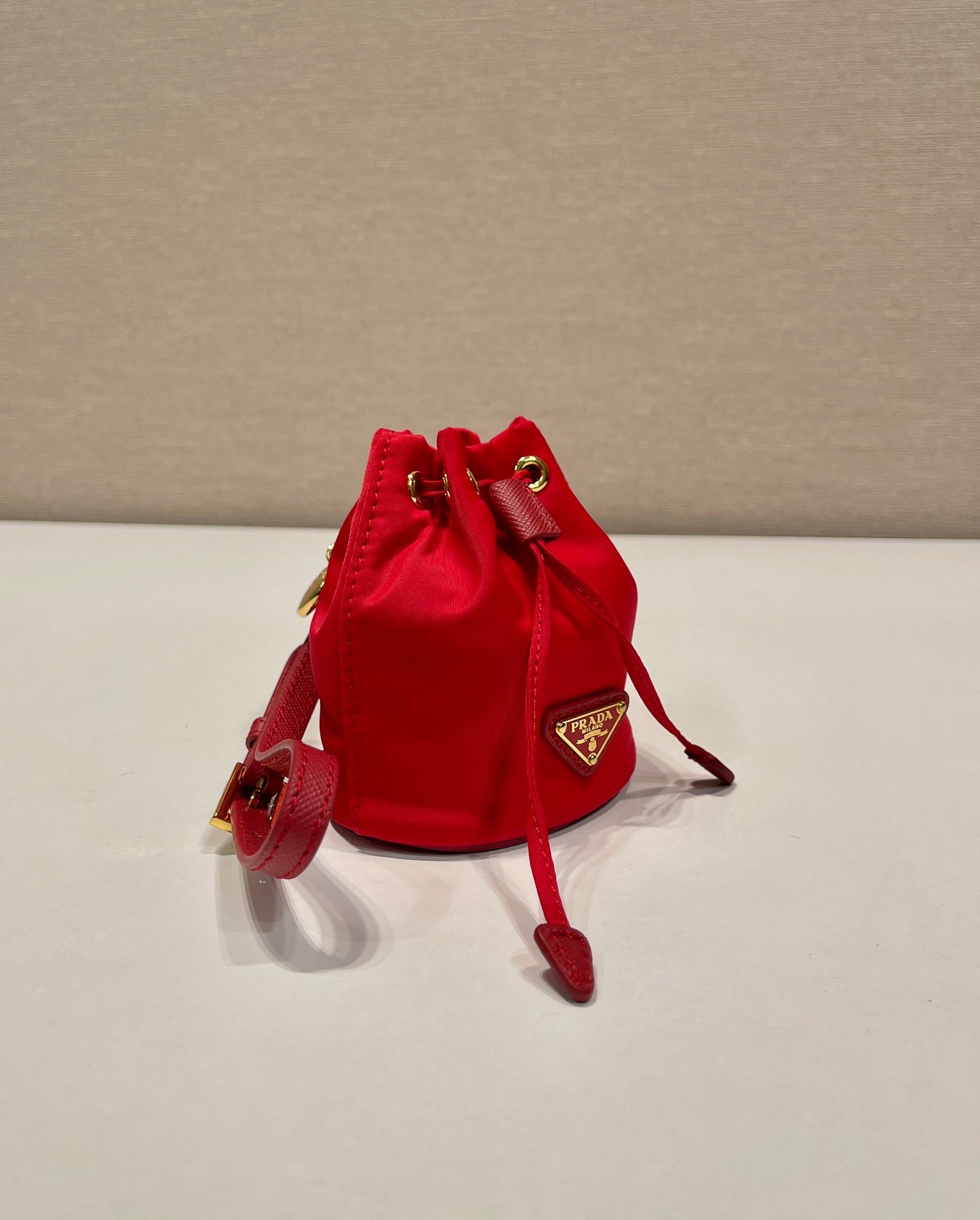 MINI BUCKET BAG 10 IN RED RE-NYLON AND SAFFIANO LEATHER STRAP mysite