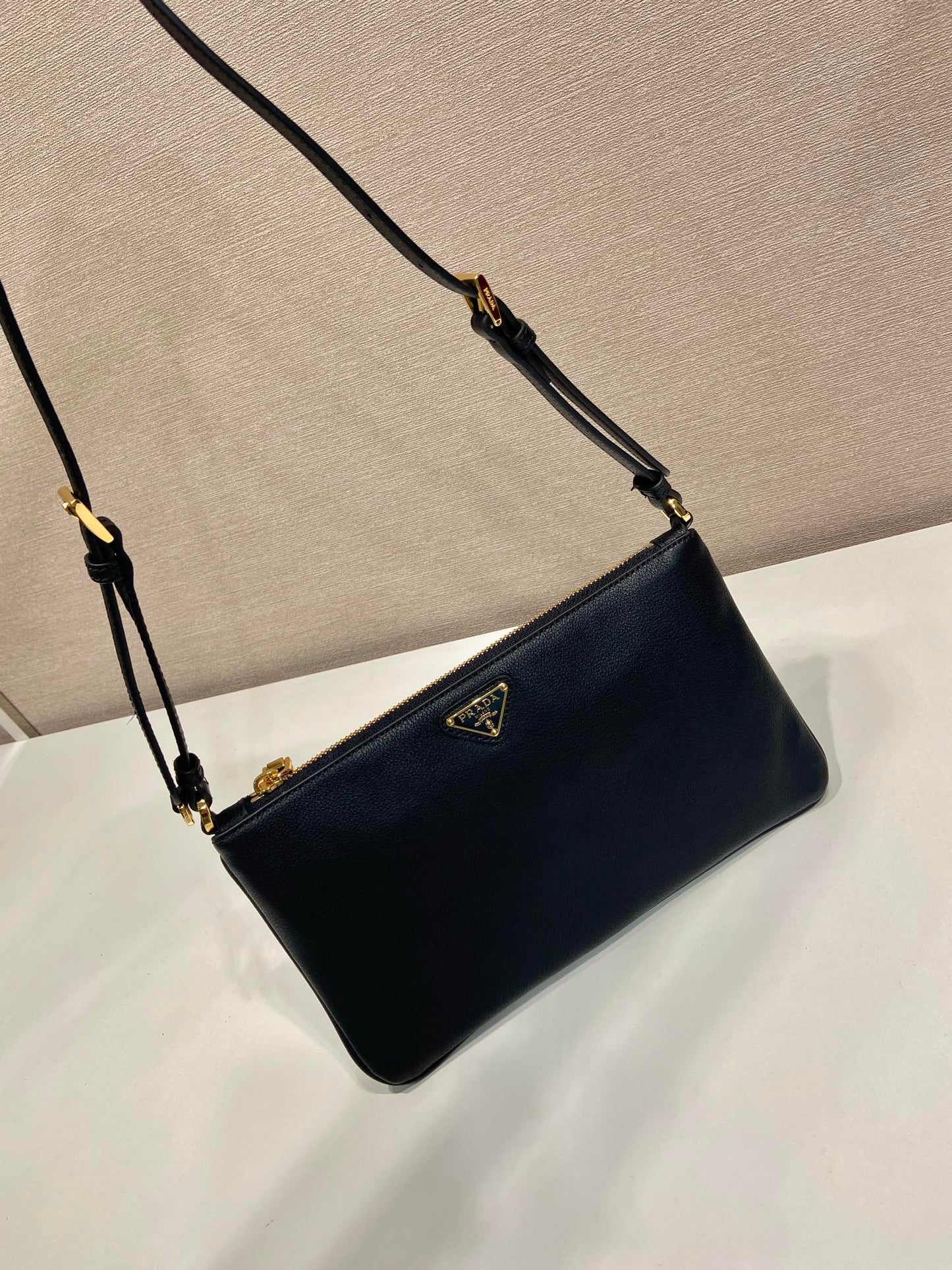 TRIANGLE LOGO SHOULDER BAG 24 IN BLACK SMOOTH CALFSKIN mysite