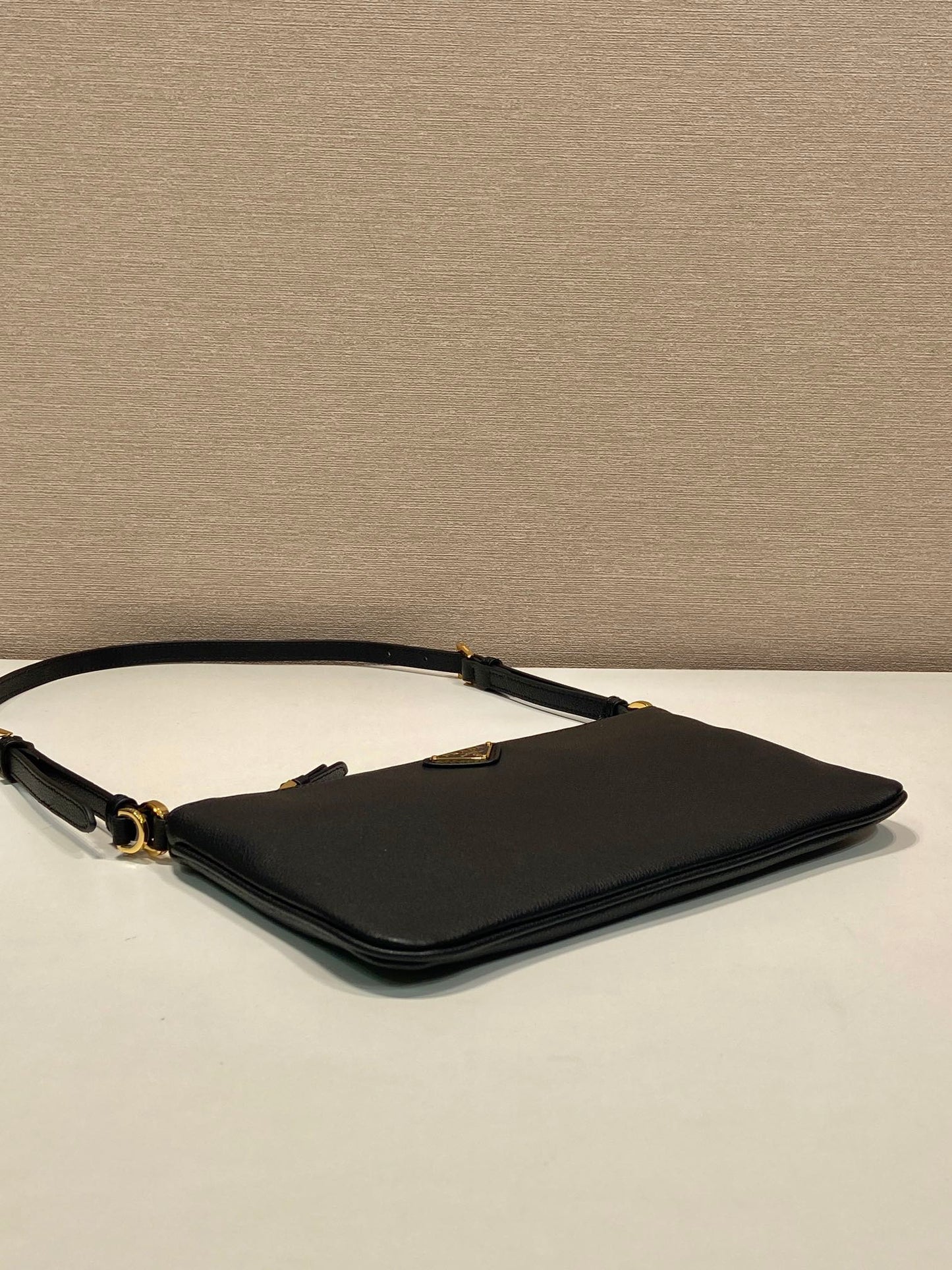 TRIANGLE LOGO SHOULDER BAG 24 IN BLACK SMOOTH CALFSKIN mysite