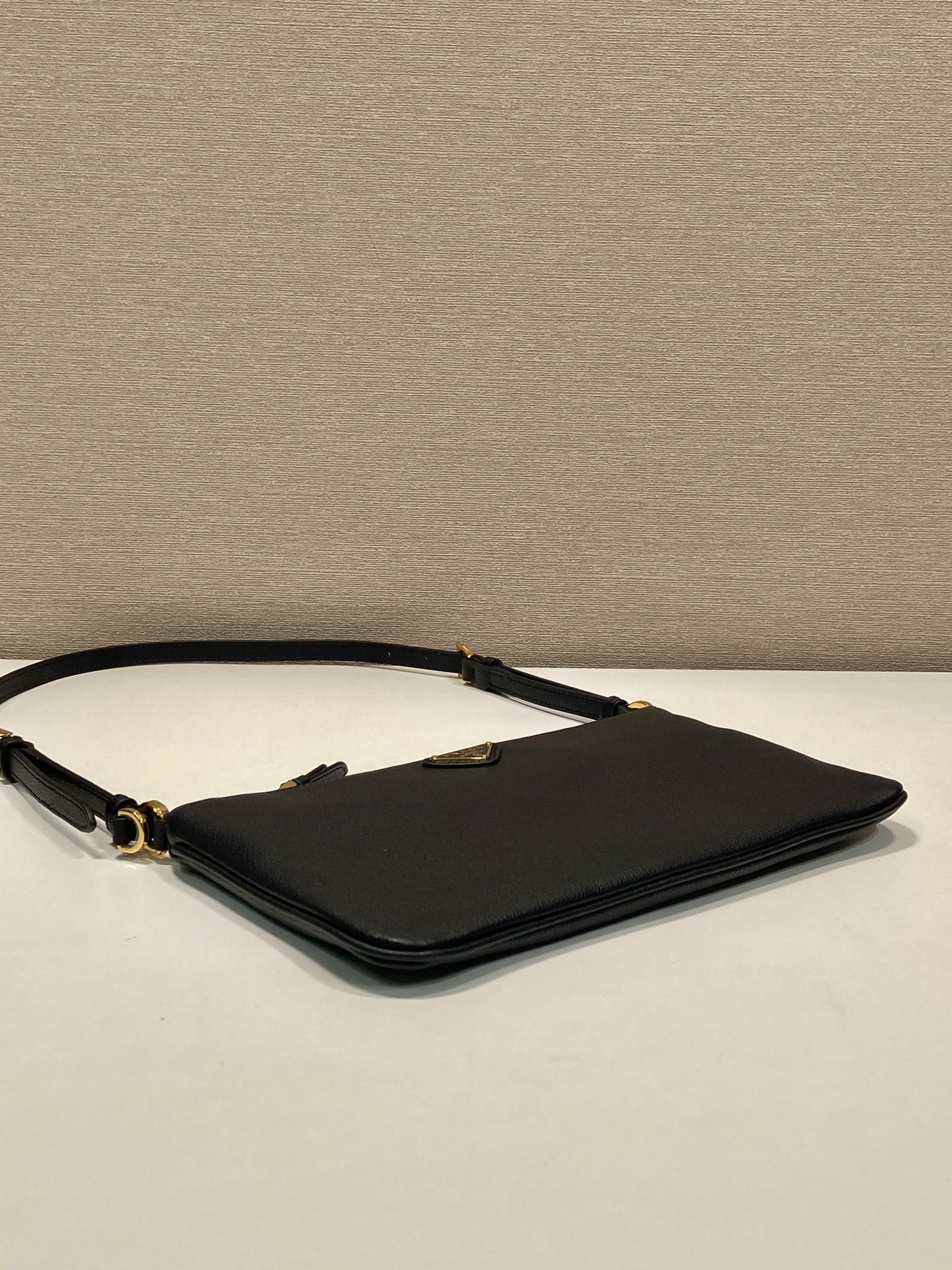 TRIANGLE LOGO SHOULDER BAG 24 IN BLACK SMOOTH CALFSKIN mysite