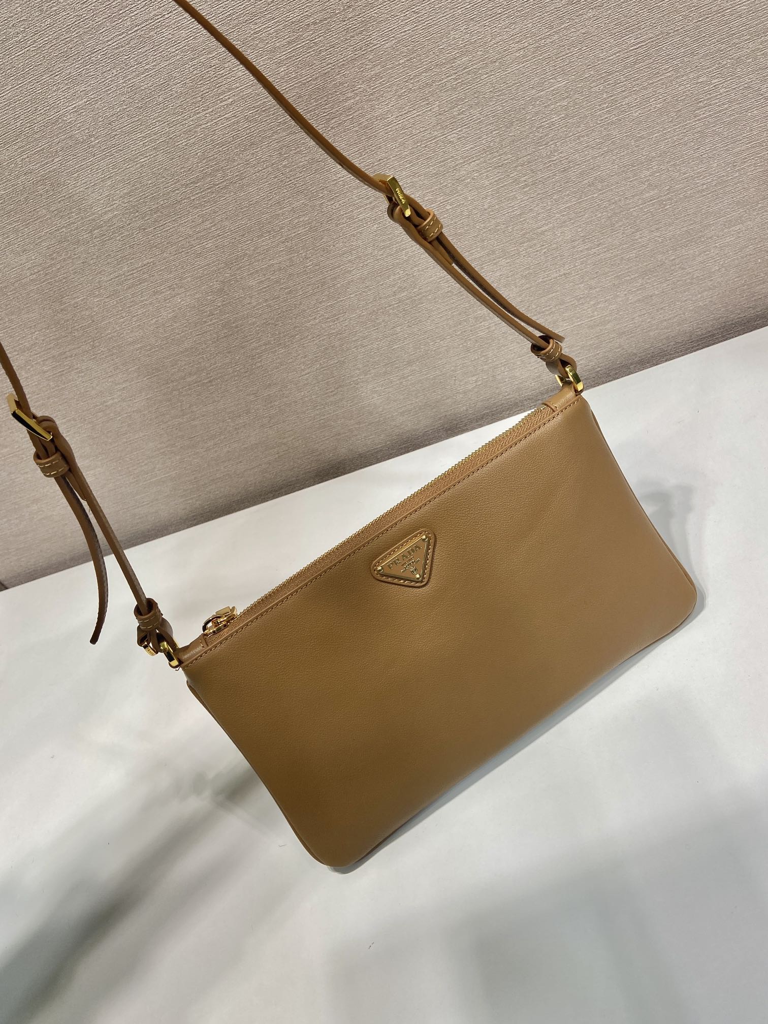 TRIANGLE LOGO SHOULDER BAG 24 IN PEANUT BROWN SMOOTH CALFSKIN mysite